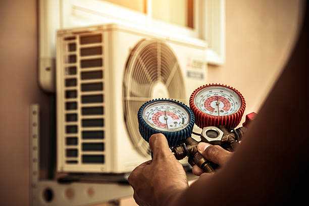 Professional Air Conditioning Service technician working in Inwood, WV